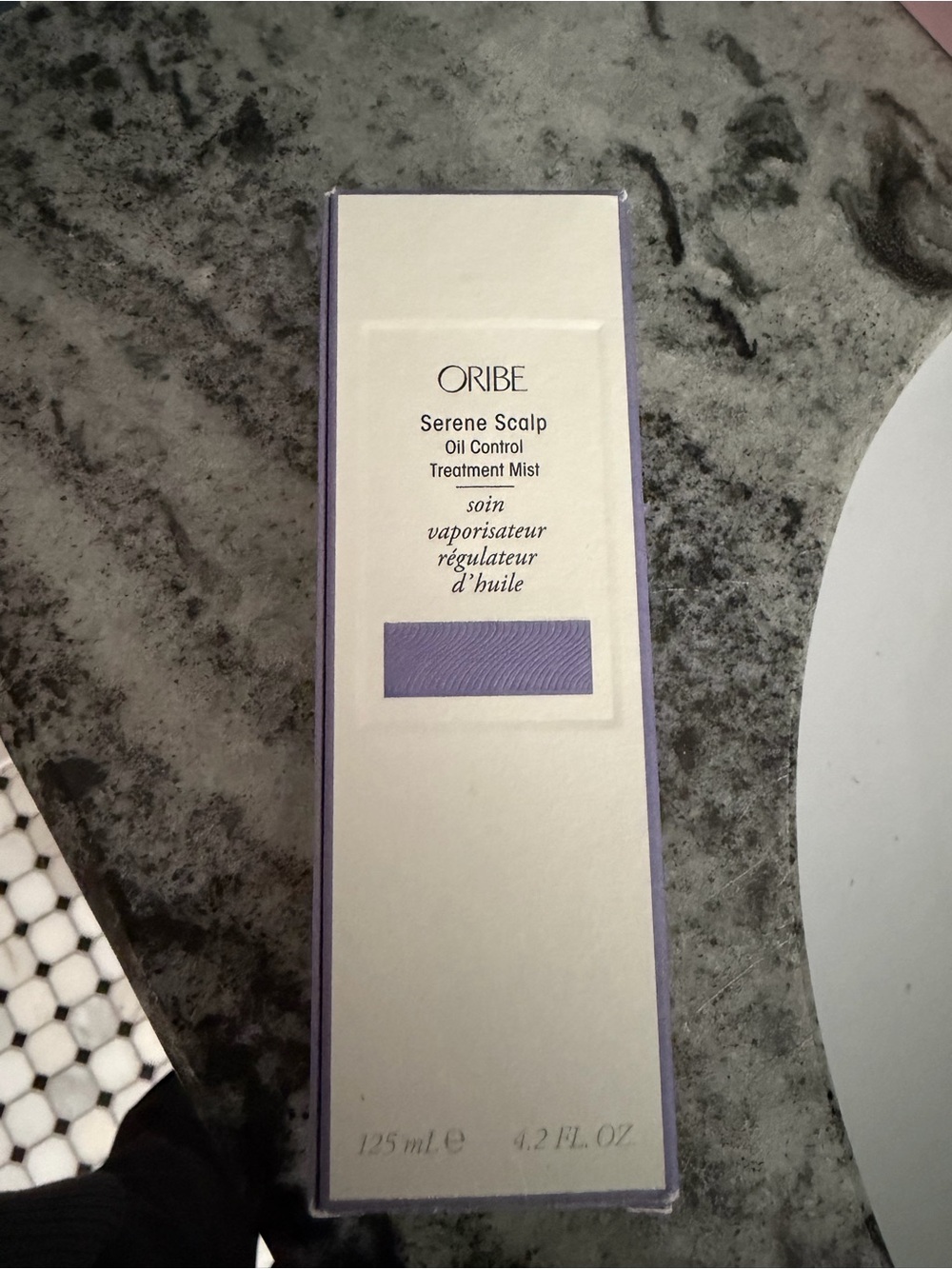 Oribe Serene Scalp Oil Control Treatment Mist, a 4.2 fl. oz. mattifying scalp tr